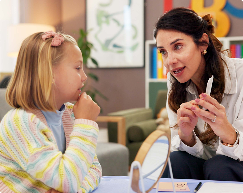 Woman explaining to attentive child